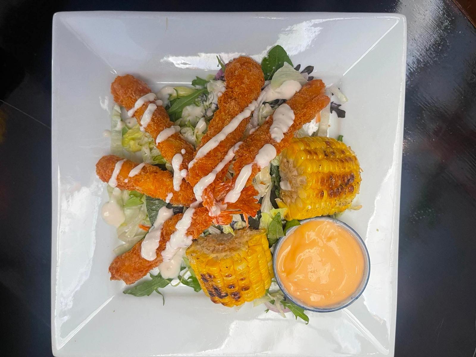 Crispy prawn salad with grilled corn and dressing