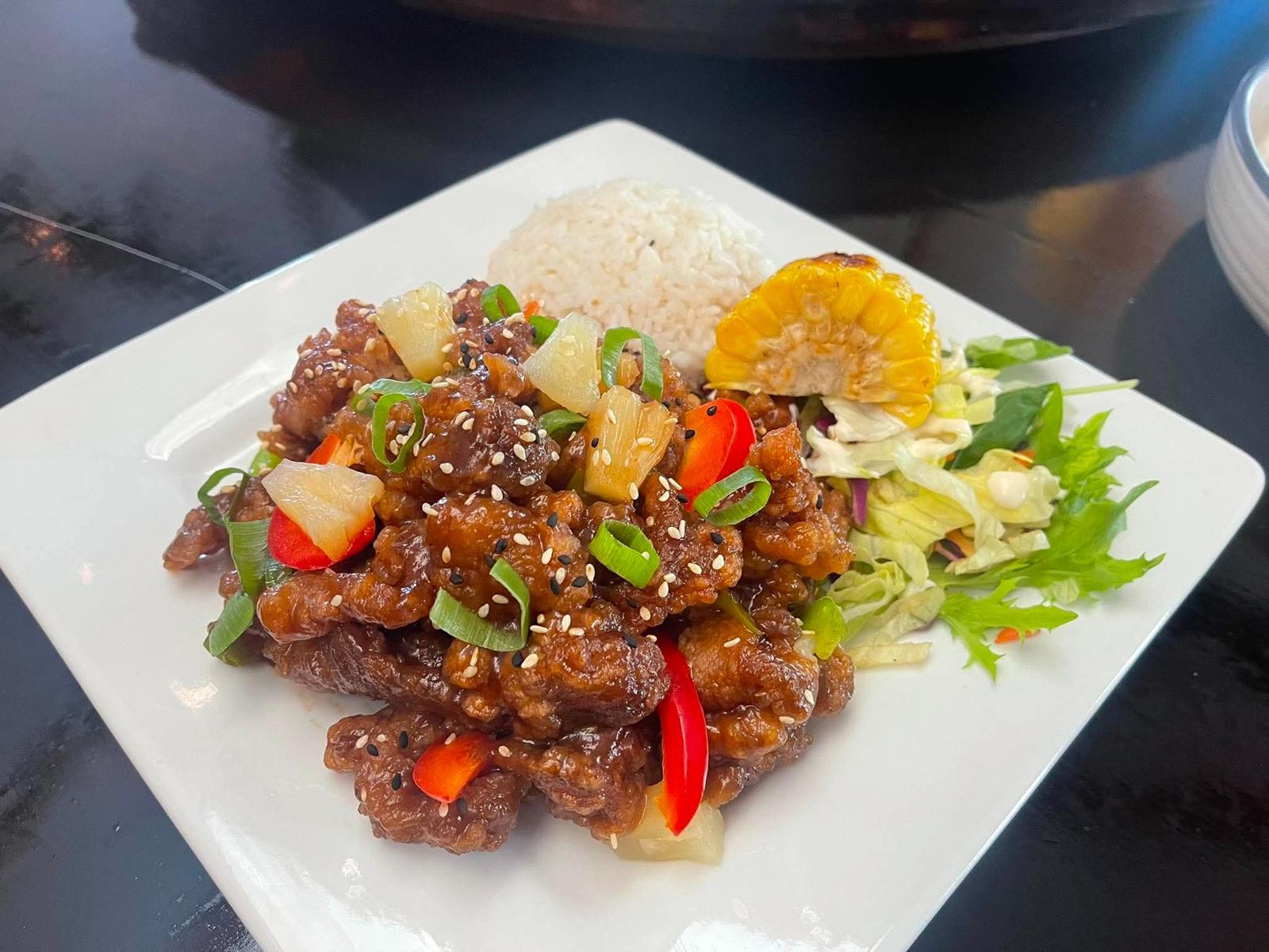 Sticky sesame pork with pineapple and rice
